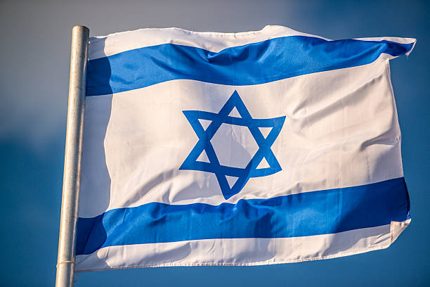 istock Flag of Israel on blue sky 623300428