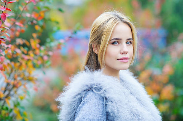 istock Beautiful young woman on autmn background 623300788