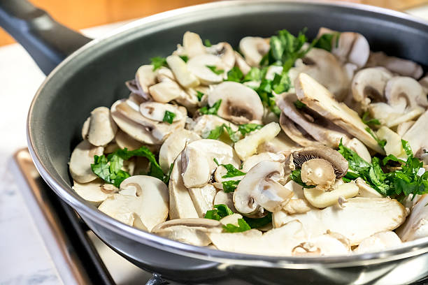 istock Mushroom slice pan cooking raw closeup 623300976