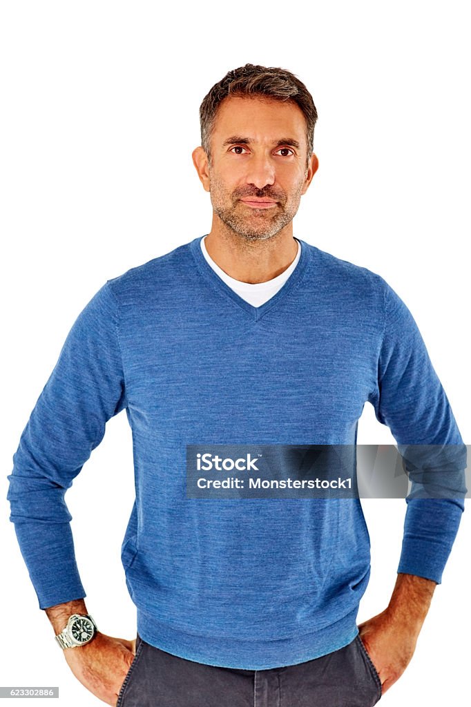 Happy mature man standing casually Studio shot of handsome mature man standing with his hands in pocket on white background Men Stock Photo