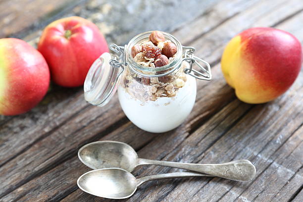 istock White yogurt with granola and fruits 623305678