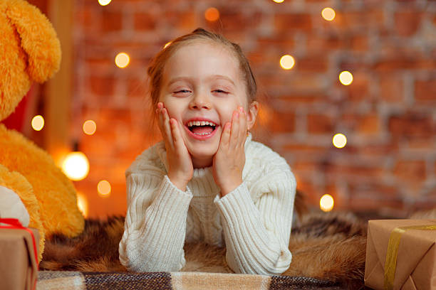 istock Girl lying on the carpet, looking at the camera 623306570