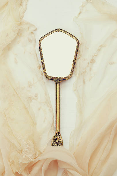 istock Top view image of vintage hand mirror and lace scarf 623307782