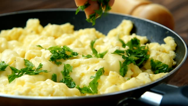 Perfect scrambled omelette with parsley and feta cheese