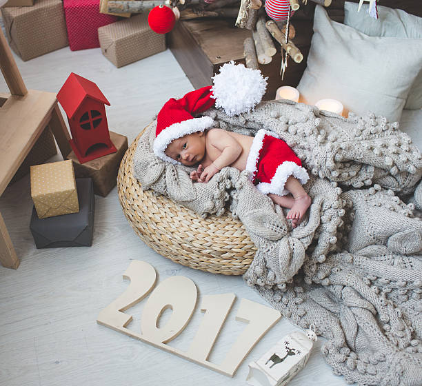 istock Newborn baby  in Santa clothes 623344404