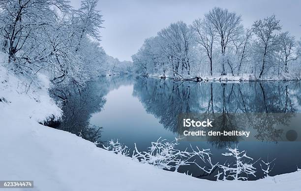 Colorful Landscape With Snowy Trees Beautiful Frozen River At Sunset Stock Photo - Download Image Now