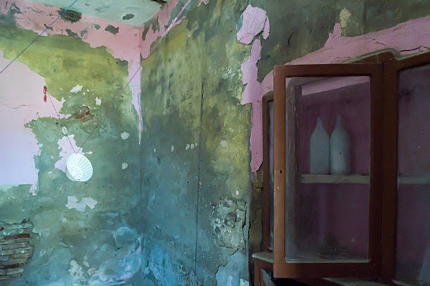 istock Old sideboard in the abandoned house with old bottle inside 623345328