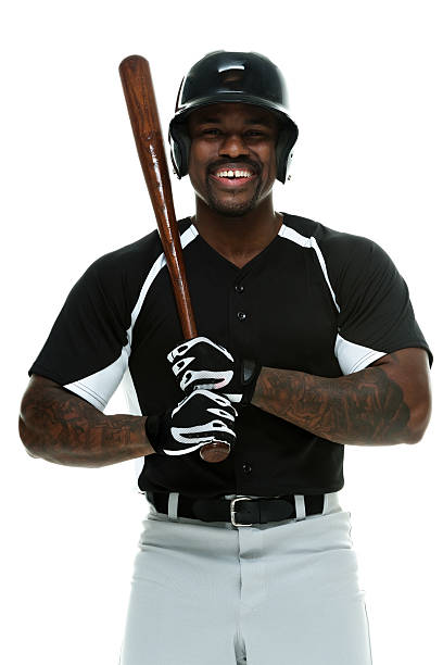 uśmiech baseballista trzyma bat - baseball player baseball holding bat zdjęcia i obrazy z banku zdjęć