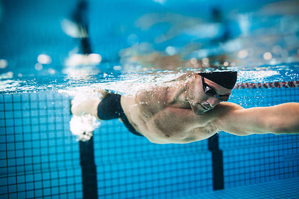 istock Professional male athlete swimming in pool 623345942