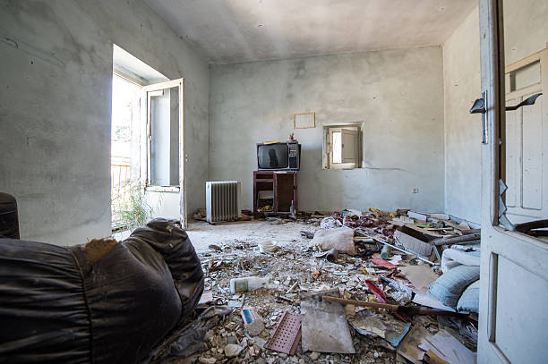istock Room destroyed with furniture and old television 623347586