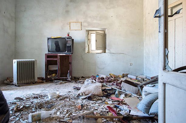 istock Room destroyed with furniture and old television 623347680