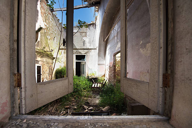 istock Door of balcony destroyed with landscape 623348194