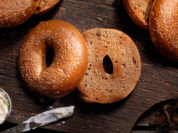 Toasted Bagels with Butter Toasted Bagels with Butter - Photographed on a Hasselblad H3D11-39 megapixel Camera System PLAIN BAGEL stock pictures, royalty-free photos & images