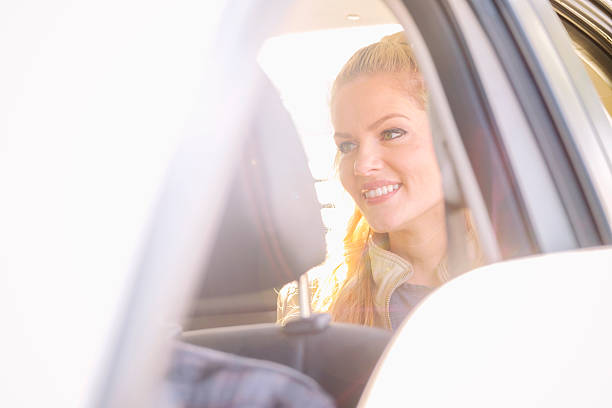 istock Woman in a Ride Share Taxi 623350026