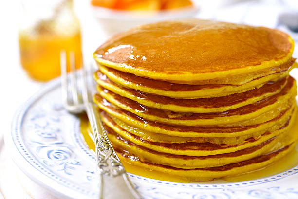 istock Pumpkin pancakes with honey for a breakfast. 623354060