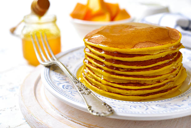 istock Pumpkin pancakes with honey for a breakfast. 623354504