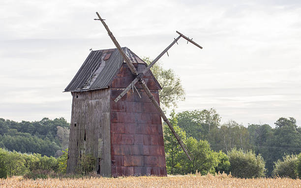 istock Kawnice, Poland. Old ruined windmill on the field. 623355948