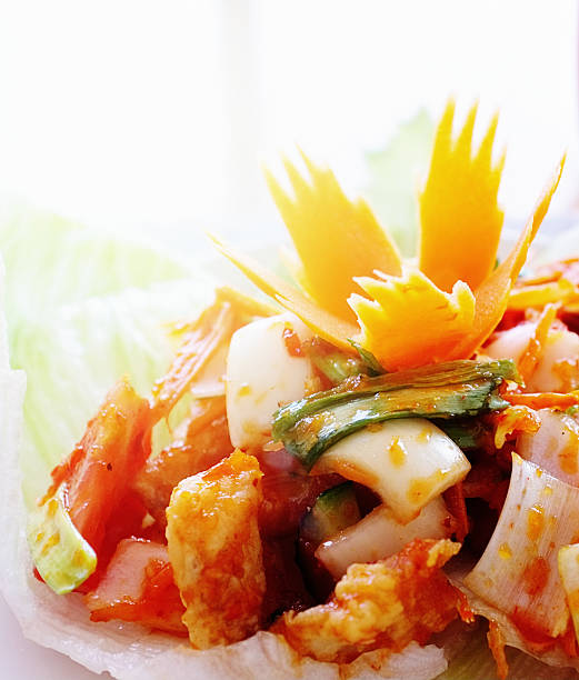 Sweet-and-sour Thai fish salad  with carrot garnish