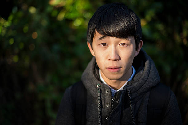 istock Young Japanese student in autumn light 623356882