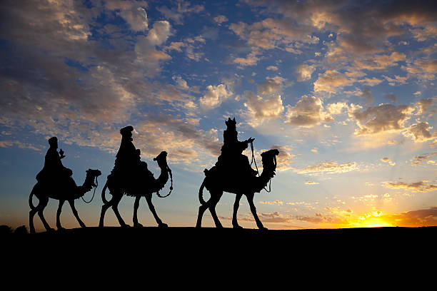 Christmas Nativity Scene, Three Wisemen against Sunset Sky stock photo