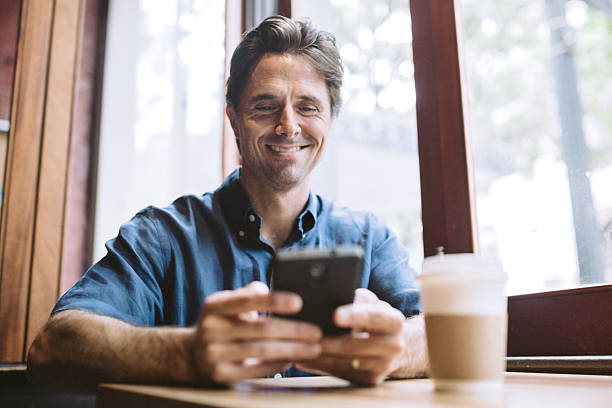 istock Mature Man on Smartphone at Cafe 623357456