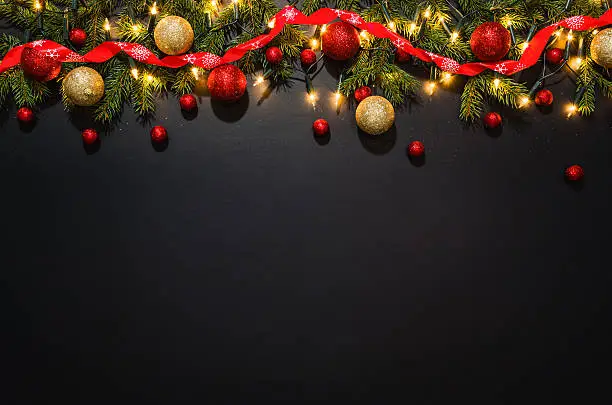 Photo of Christmas decoration background over black chalkboard