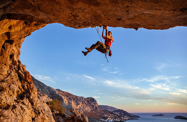istock Male climber on challenging route in cave 623360740