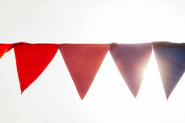 istock Celebration color pennants against sunshine 623361896