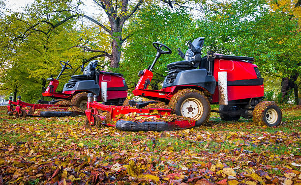 istock Lawn mowers in autumn park,two of them 623362556