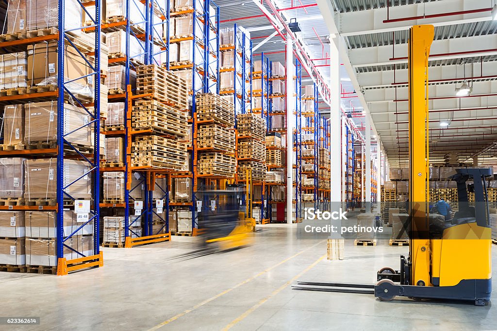 Modern warehouse interior Large modern warehouse with forklifts Warehouse Stock Photo