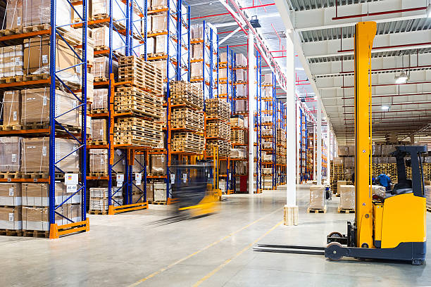Modern warehouse interior Large modern warehouse with forklifts pallet industrial equipment stock pictures, royalty-free photos & images