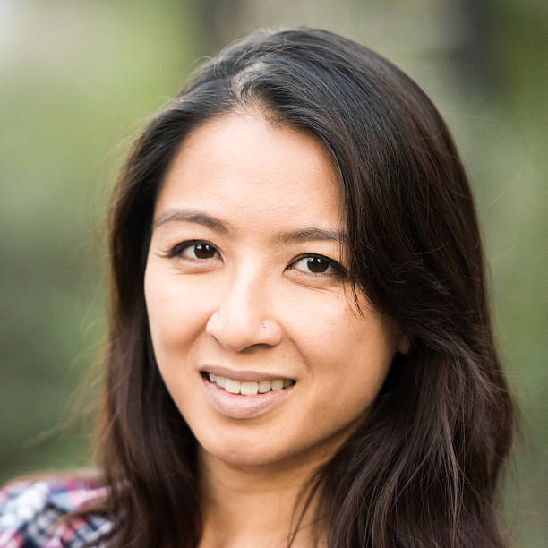istock Smiling asian woman looking at the camera 623365568