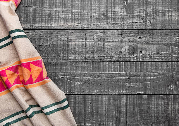 istock Warm soft wool scarf on wooden background texture 623368104
