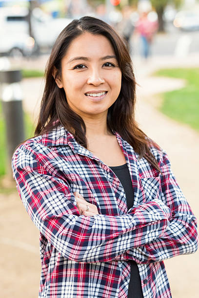 istock Smiling asian woman looking at the camera 623369570