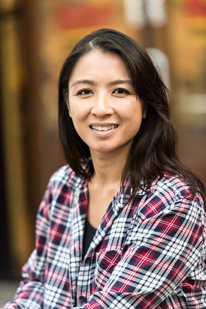 istock Smiling asian woman looking at the camera 623369894