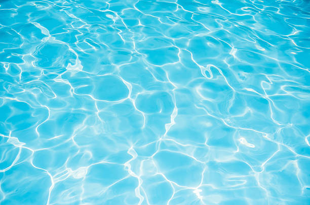 istock Beautiful blue water surface in swimming pool 623370094