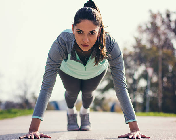 istock Young sportswoman stretching and preparing to run 623371584