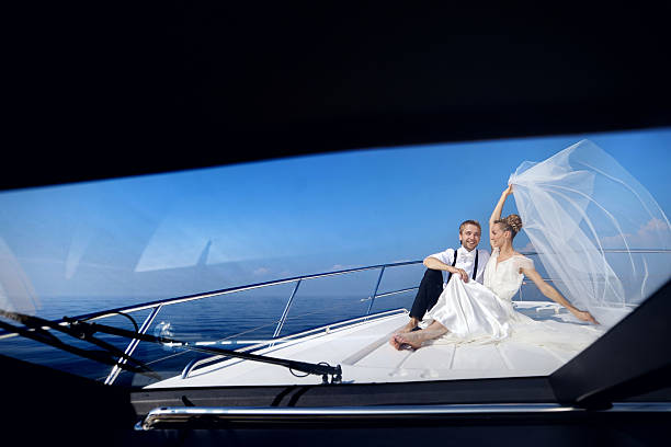 istock Happy bride and groom on a yacht 623371628