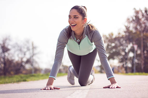 istock Young sportswoman stretching and preparing to run 623371740