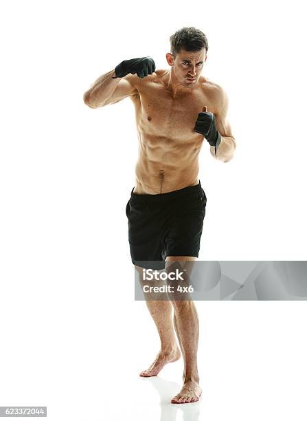 Mixed Martial Arts Fighter Fighting Stock Photo - Download Image Now - Mixed Martial Arts, Boxing - Sport, Combat Sport