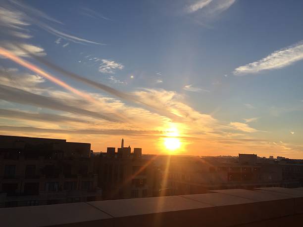 istock sun setting over the United States Capitol on a clear 623372822