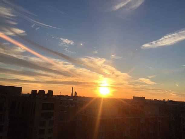 istock sun setting over the United States Capitol on a clear 623372846