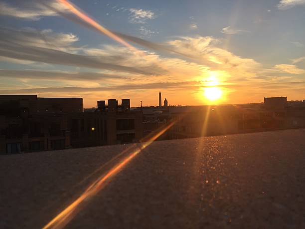 istock sun setting over the United States Capitol on a clear 623372888