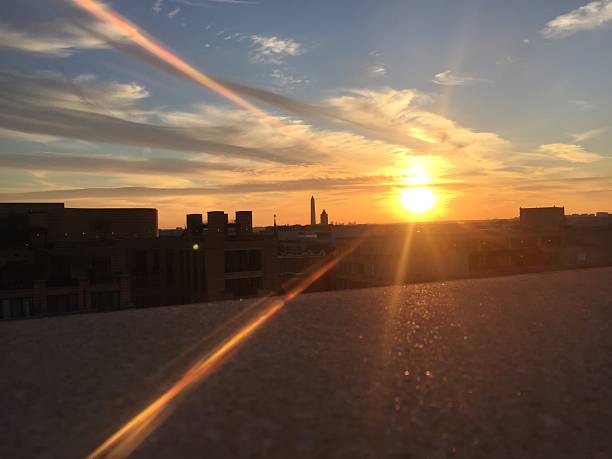 istock sun setting over the United States Capitol on a clear 623372944
