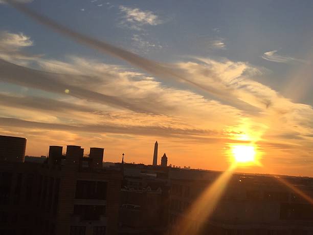 istock sun setting over the United States Capitol on a clear 623373024