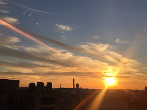 istock sun setting over the United States Capitol on a clear 623373096