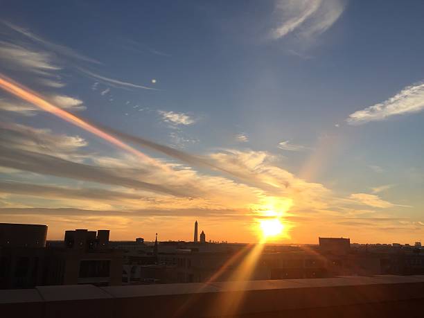 istock sun setting over the United States Capitol on a clear 623373128