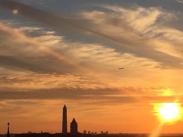 istock sun setting over the United States Capitol on a clear 623373158