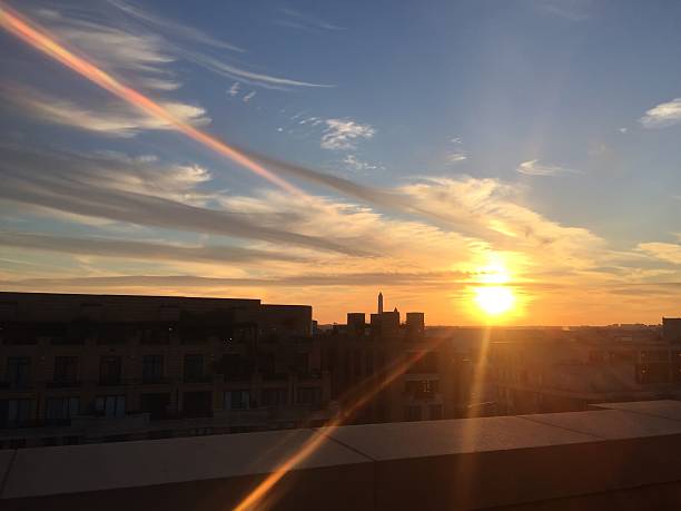 istock sun setting over the United States Capitol on a clear 623373192