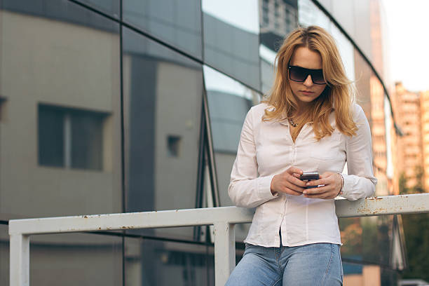 istock Happy young woman calling on the phone 623374372